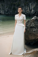 White satin taffeta gown by Lune De Soie featuring elegant, flowing fabric and a sophisticated design.