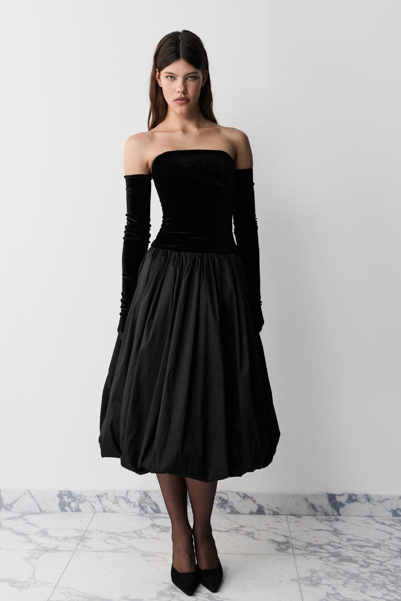 Black Transformer midi skirt by Balykina, featuring a stylish, fitted design with a sleek fabric finish and versatile length.