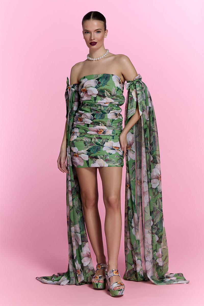 Nur Karaata Poppy Reverie Dress, a stylish mini dress with floral pattern and elegant fit, shown on a model.