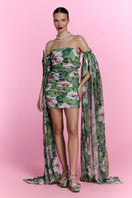 Nur Karaata Poppy Reverie mini dress in vibrant floral print, sleeveless design with a fitted waist and flowy skirt.