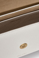 Off-white Vikele Studio Katrine shoulder bag with sleek design and shoulder strap, made of smooth material.