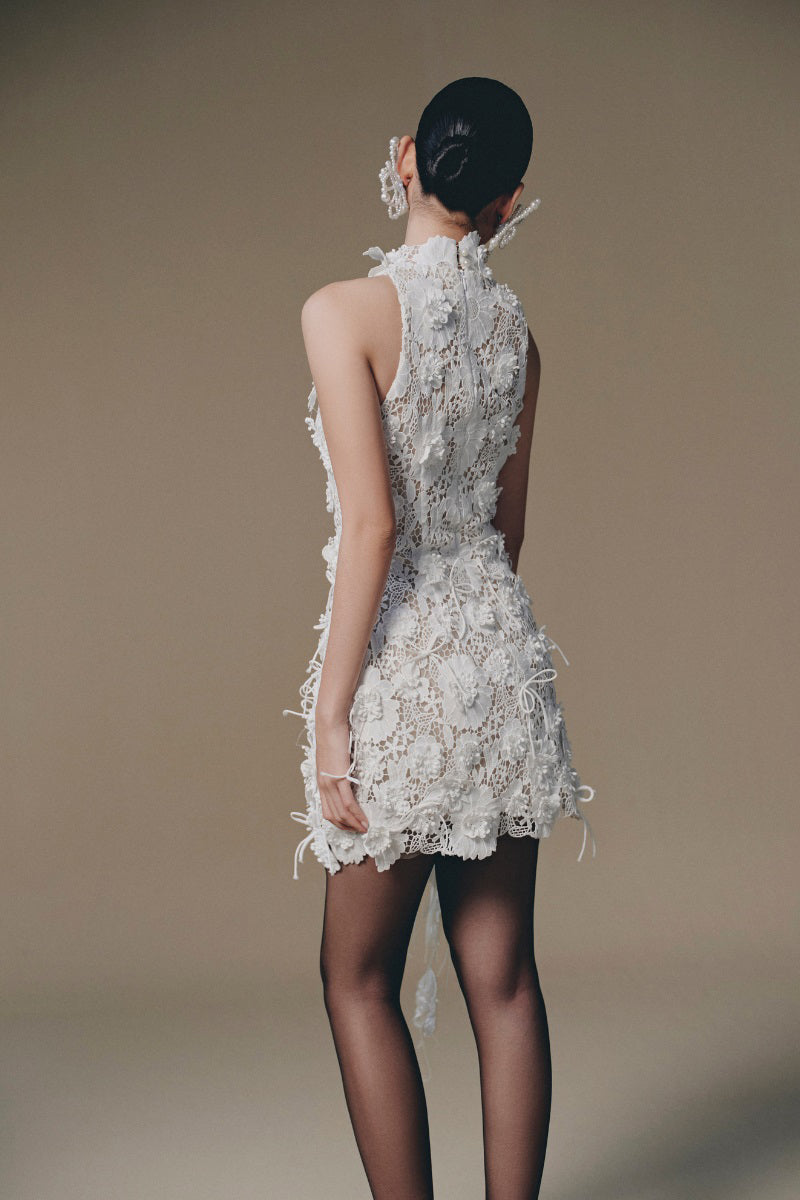 Keira Tong Belle Jardin mini dress with floral pattern, sleeveless design, and fitted waist for a stylish summer look.