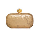 Sarah's Bag moon on gold box clutch with elegant design, featuring a gold-toned surface and decorative moon embellishment.