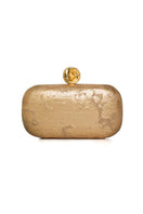 Sarah's Bag moon on gold box clutch with elegant design, featuring a gold-toned surface and decorative moon embellishment.