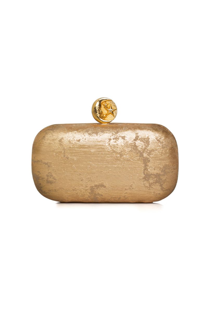 Sarah's Bag moon on gold box clutch with elegant design, featuring a gold-toned surface and decorative moon embellishment.