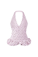Stolen Stores purple polka dot mini crop top with long sleeves, featuring a trendy Kapi design and stylish fit.
