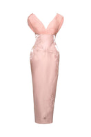 Do Long blush Aurora pink gown with elegant flowing fabric and intricate detailing, showcased on a model.