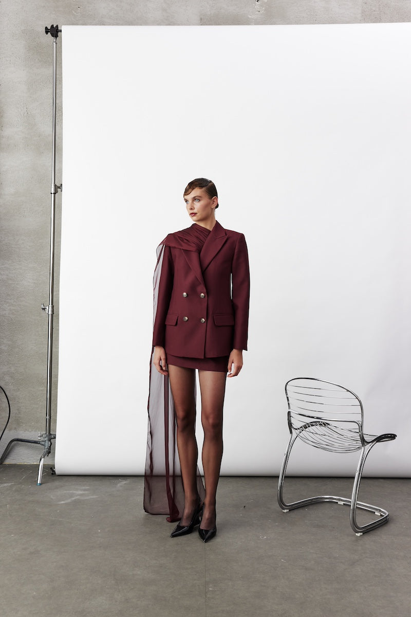Nazlı Ceren Elodie Bordeaux jacket featuring a tailored design and rich color, displayed on a hanger against a neutral background.