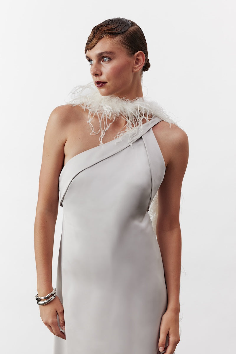 Nazlı Ceren Aimee long satin silver maxi dress displayed on a model, featuring elegant flowing fabric and evening wear style.