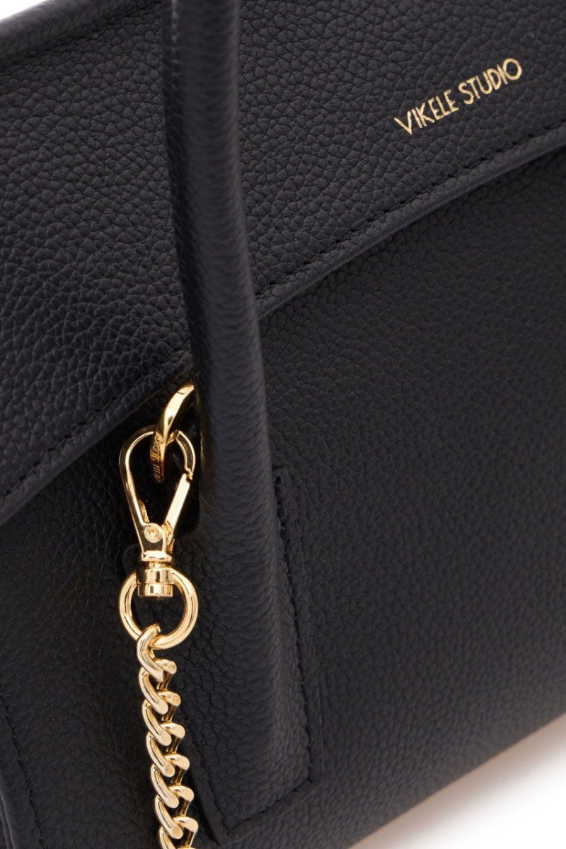 Black CELINE mini top handle bag by VIKELE STUDIO, showcasing its sleek design and compact size with top handle detail.