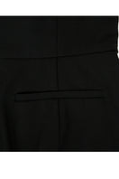 Black asymmetric-beck sleeveless jumpsuit by JINSUN, featuring a stylish, modern design with a fitted silhouette and unique neckline.
