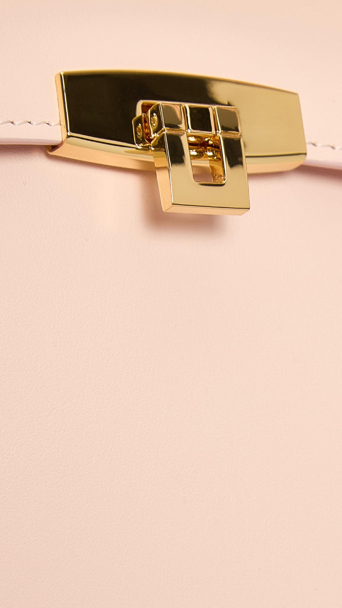 Pink Stephanie top handle bag by Vikele Studio with a sleek design and elegant shape, perfect for stylish everyday use.