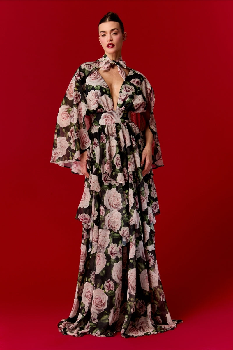 Nur Karaata Beatrice Maxi Dress with flowing fabric and elegant design, showcased on a model in a bright, stylish setting.