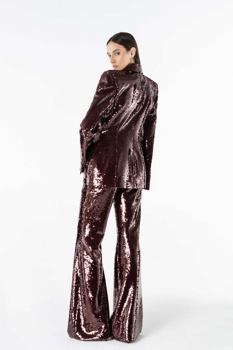 Lili Blanc sequin peak blazer featuring a tailored fit, shiny sequins, and structured design perfect for stylish formal or casual wear.