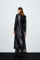 Black Venus Maxi Blazer by Acaria Studio, displayed on a hanger, showcasing its tailored fit and sleek design.