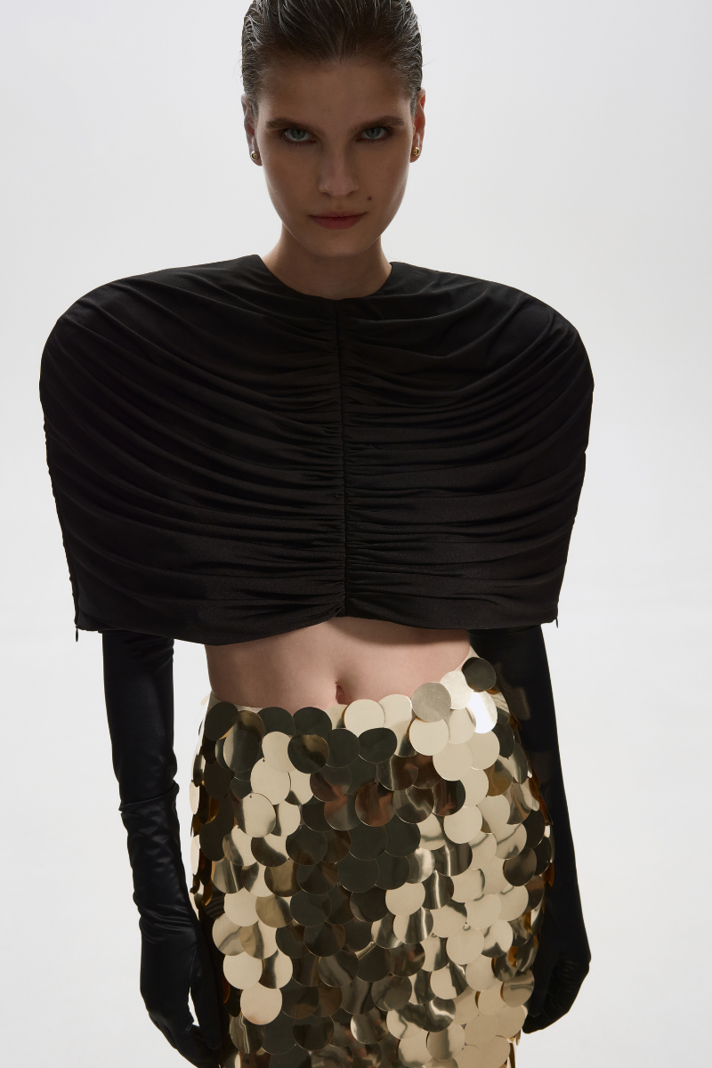 Black stretch cape jacket by Balykina, featuring a flowing design and elegant drape, perfect for stylish layering.