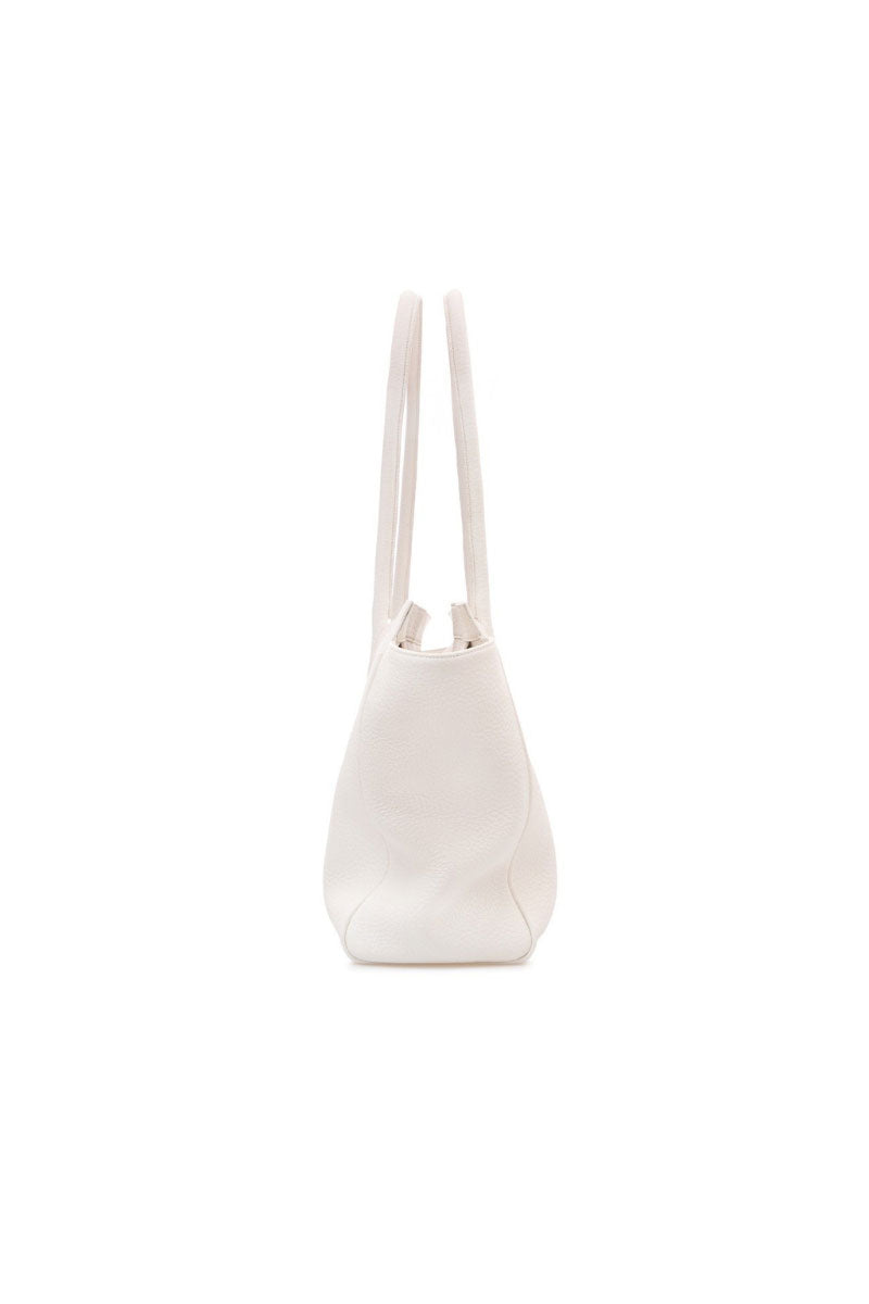 Off-white Vikele Studio tote bag with shoulder strap, spacious and stylish, shown in a close-up image of the bag’s material and design.