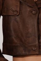 Double A Audax leather jacket with snake print design, featuring a stylish, fitted jacket with textured leather and bold snake pattern.