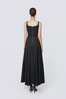 TONYY Noir Veil Maxi Dress featuring a flowing black fabric and elegant design, perfect for formal or evening occasions.