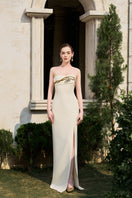 Tracy Studio matte weave gown featuring a flowing fabric and elegant design, displayed on a mannequin.