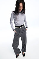 Chictopia layered grey cashmere sweater with a soft, cozy knit, styled with a relaxed fit and modern design.