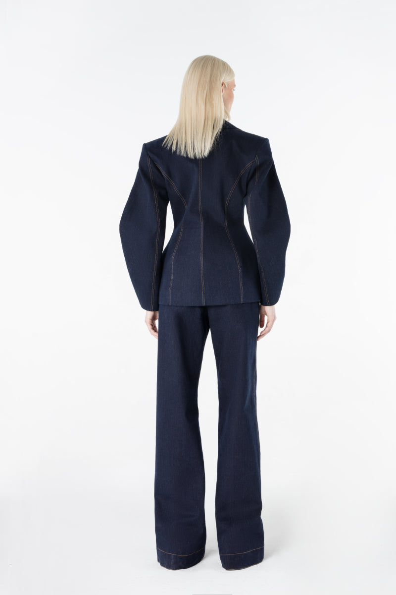 Lili Blanc Nova blazer in classic tailored style, featuring a fitted design and lapel collar, shown in dark fabric.