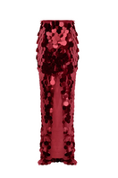 BalYKINA burgundy sequined maxi skirt with flowing fabric and elegant design, displayed hanging with a smooth backdrop.