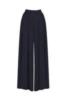 Black Sufia pants by Mastani featuring a relaxed fit and stylish design, shown on a model.
