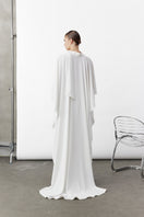 White Caro Crepe Cape jacket by Nazlı Ceren, showcasing flowing crepe fabric and elegant drape on a neutral background.