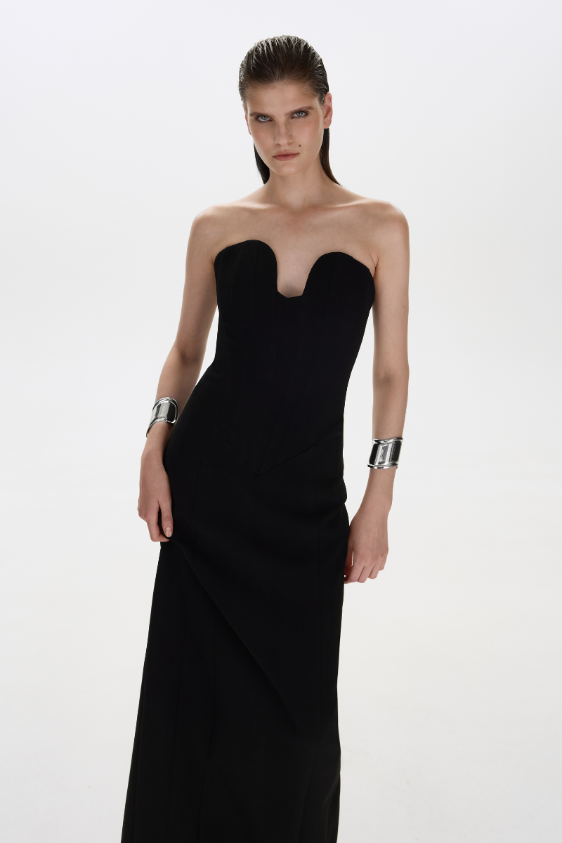 Black ARIA gown by Balykina, elegant evening dress with flowing fabric and classic silhouette, shown on a model.