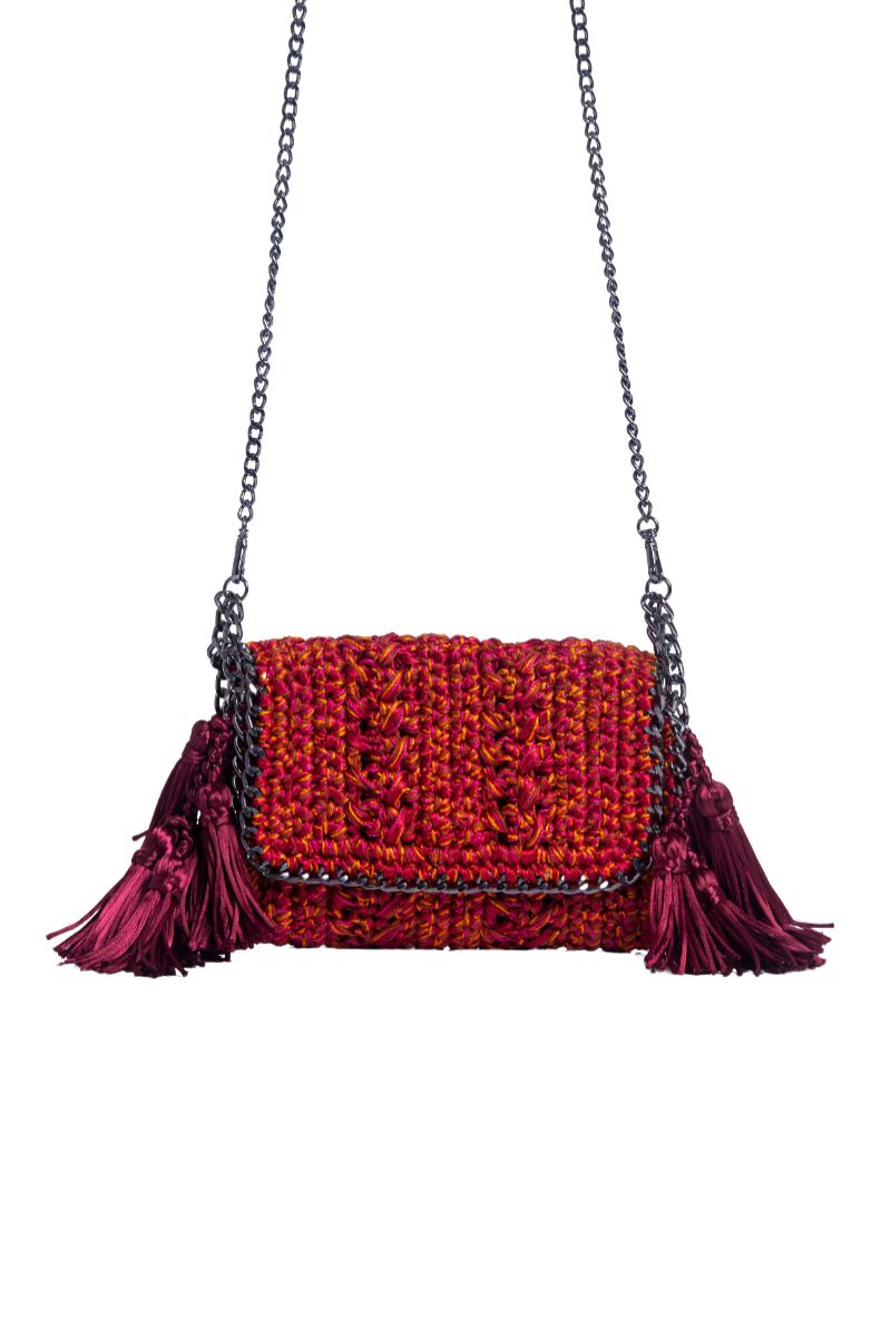 Catarina Mina Mira shoulder bag in vibrant grape-orange color with a sleek design and adjustable strap.