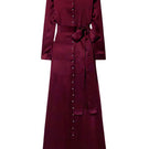 SemSem burgundy silk maxi dress with a flowing, elegant design, shown hanging on a wooden hanger.
