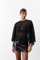 Black chiffon cape jacket by Nazlı Ceren, featuring flowy fabric and elegant design for stylish layering.