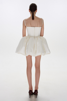 BalYKINA Charlotte Ivory Mini Dress displayed on a model, featuring a stylish and elegant design perfect for fashionable occasions.