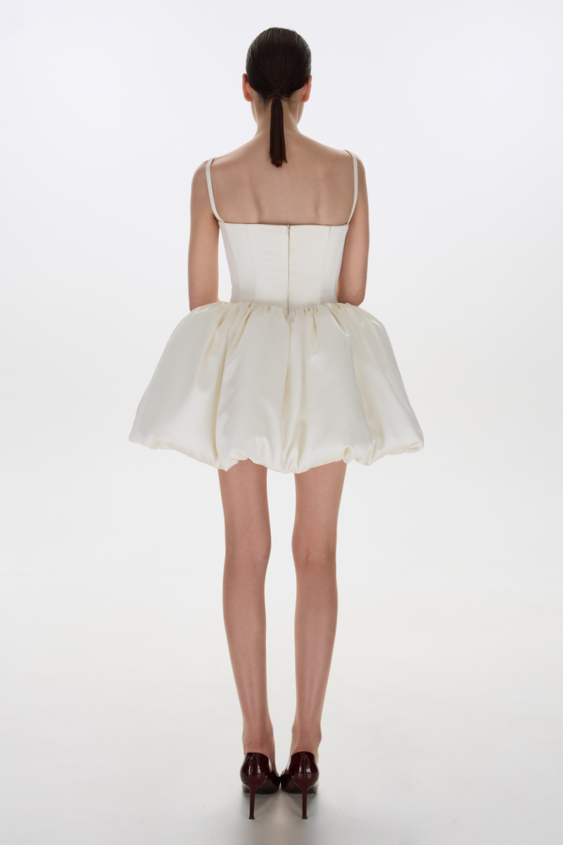 BalYKINA Charlotte Ivory Mini Dress displayed on a model, featuring a stylish and elegant design perfect for fashionable occasions.