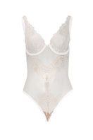 White OOLOG Bodysuit by Entos displayed on a model, showcasing its fitted design and smooth fabric.