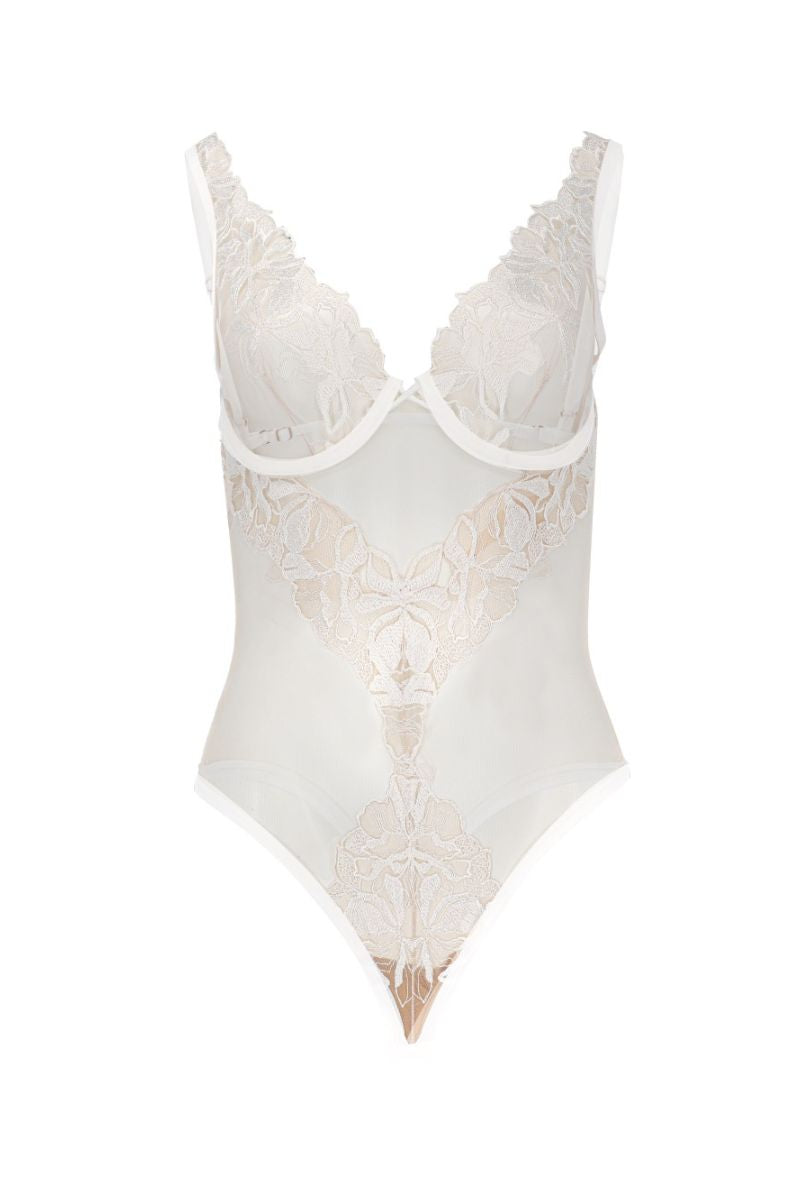 White OOLOG Bodysuit by Entos displayed on a model, showcasing its fitted design and smooth fabric.