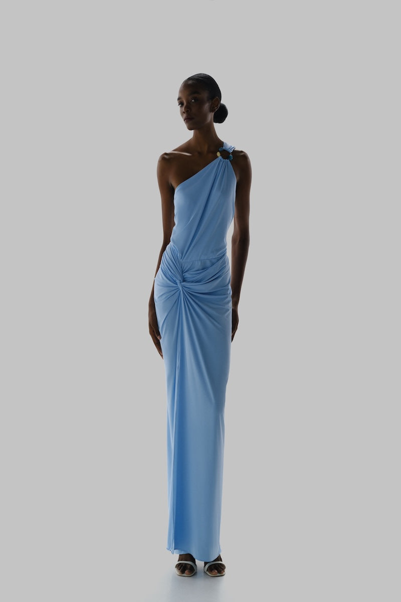 Baobab Canoa maxi dress in sky blue with flowing fabric and sleeveless design, perfect for casual or summer wear.