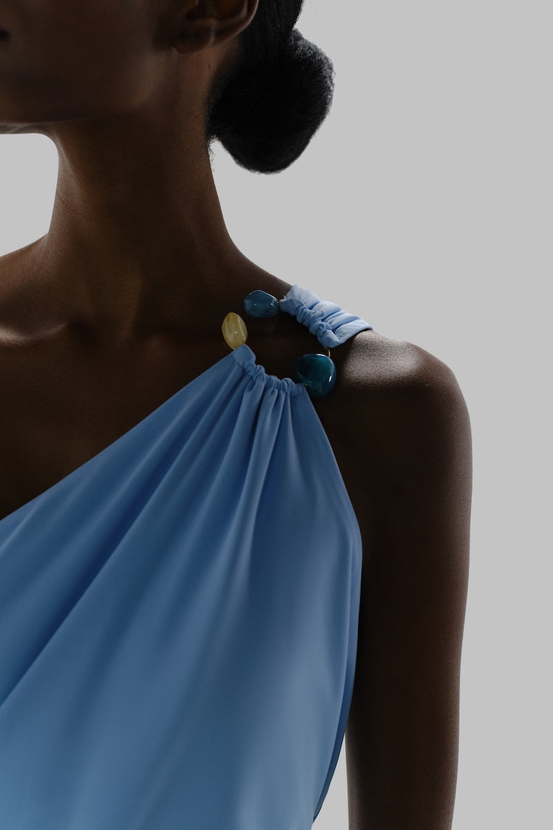 Baobab maxi dress in sky blue with flowing fabric, sleeveless design, and relaxed fit, perfect for casual summer wear.
