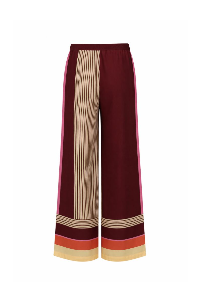Baobab NOA pants in terracotta rosata fabric, featuring a relaxed fit and stylish design, displayed on a neutral background.