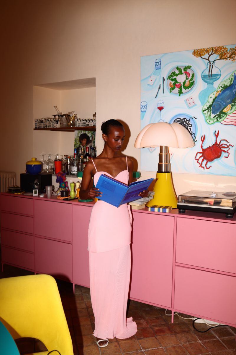 Baobab Roma crop top in Rosa Spritz, featuring a stylish, fitted design with short sleeves and vibrant pink color.