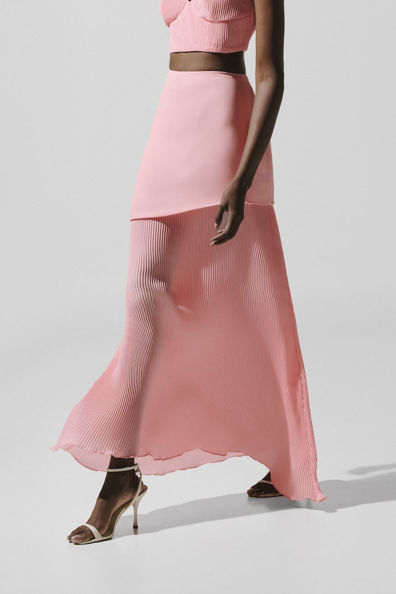 Baobab Roma Maxi Skirt in Rosa Spritz showing flowing pink fabric and high waist design on a neutral background.