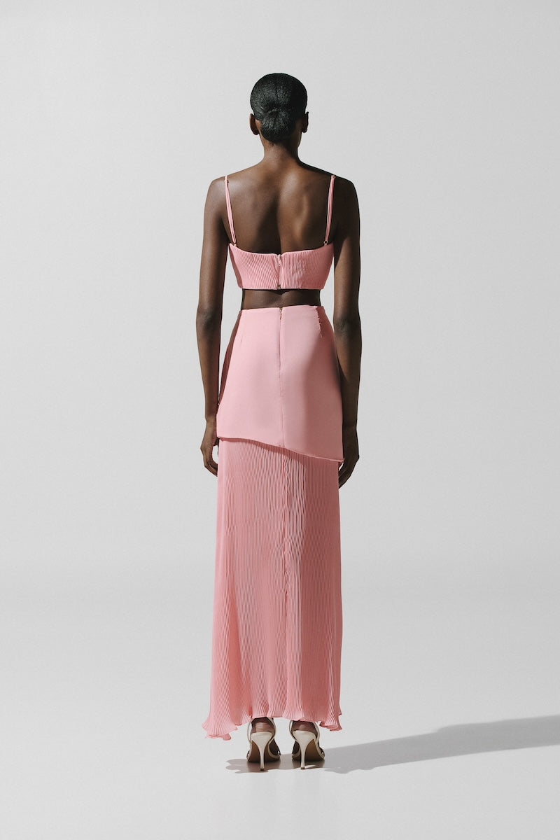 Baobab Roma Maxi Skirt in Rosa Spritz fabric, flowing design with soft pink color, styled with a casual top and accessories.