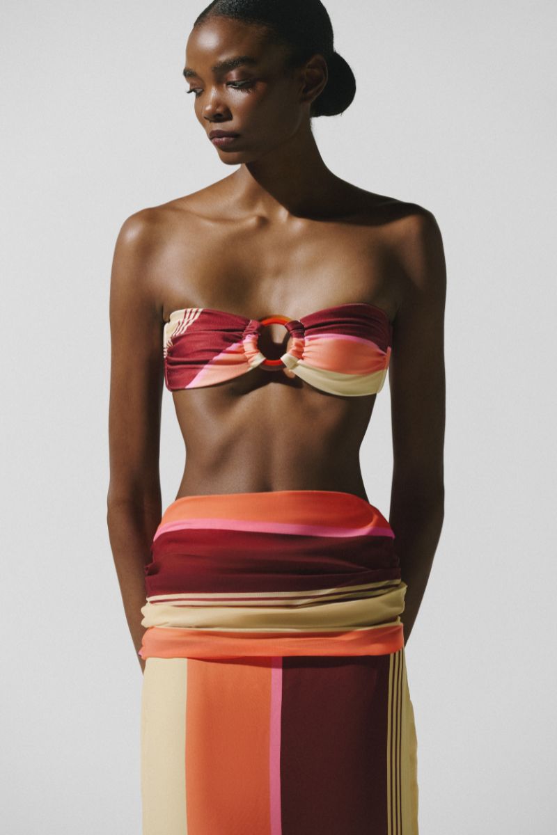 Baobab NALA bikini top in terracotta rosata with adjustable straps and tropical print, designed for a stylish summer look.