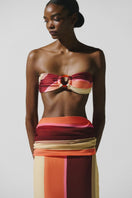Baobab NALA bikini top in terracotta rosata with adjustable straps and tropical print, designed for a stylish summer look.