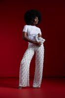 Onalaja TENE beaded white pants with intricate beadwork, showcasing a stylish and elegant design on the fabric.