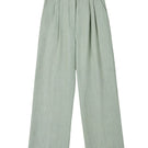 Dāl the Label linen wide-leg pants in natural beige fabric, featuring a relaxed fit and high waistband.