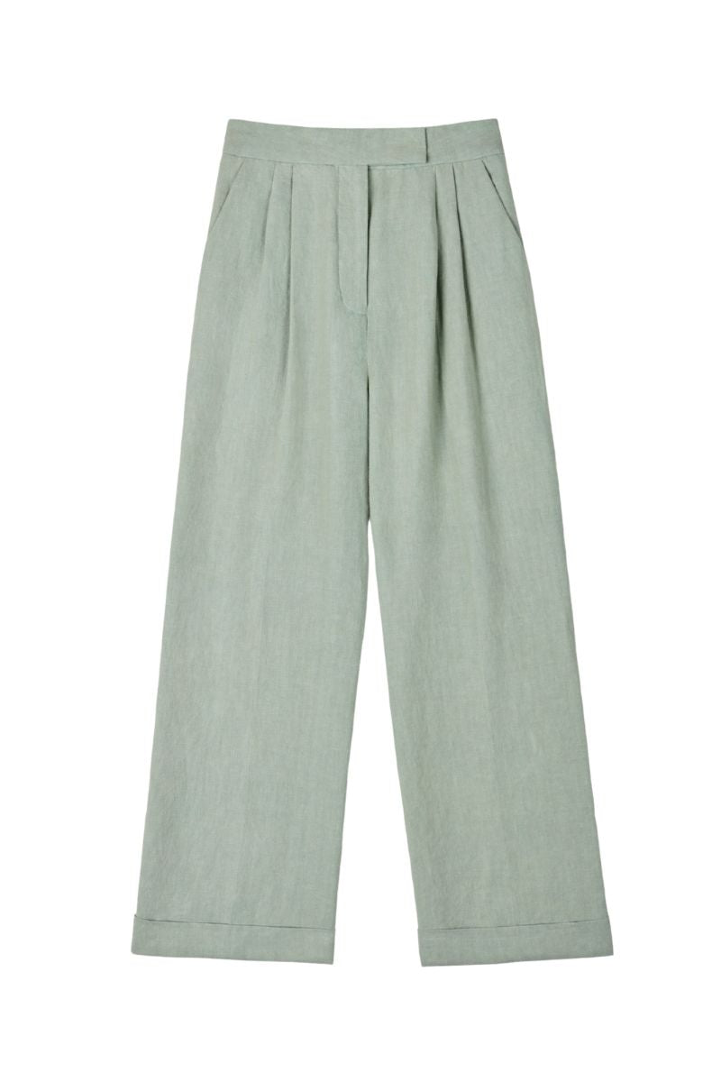 Dāl the Label linen wide-leg pants in natural beige fabric, featuring a relaxed fit and high waistband.