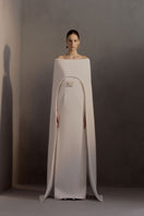 White Plan Legacy Dress gown with elegant fabric and intricate design, displayed hanging on a mannequin.
