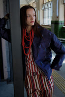 Purple textured puffer jacket by ColoReve, featuring a quilted design and cozy winter style.